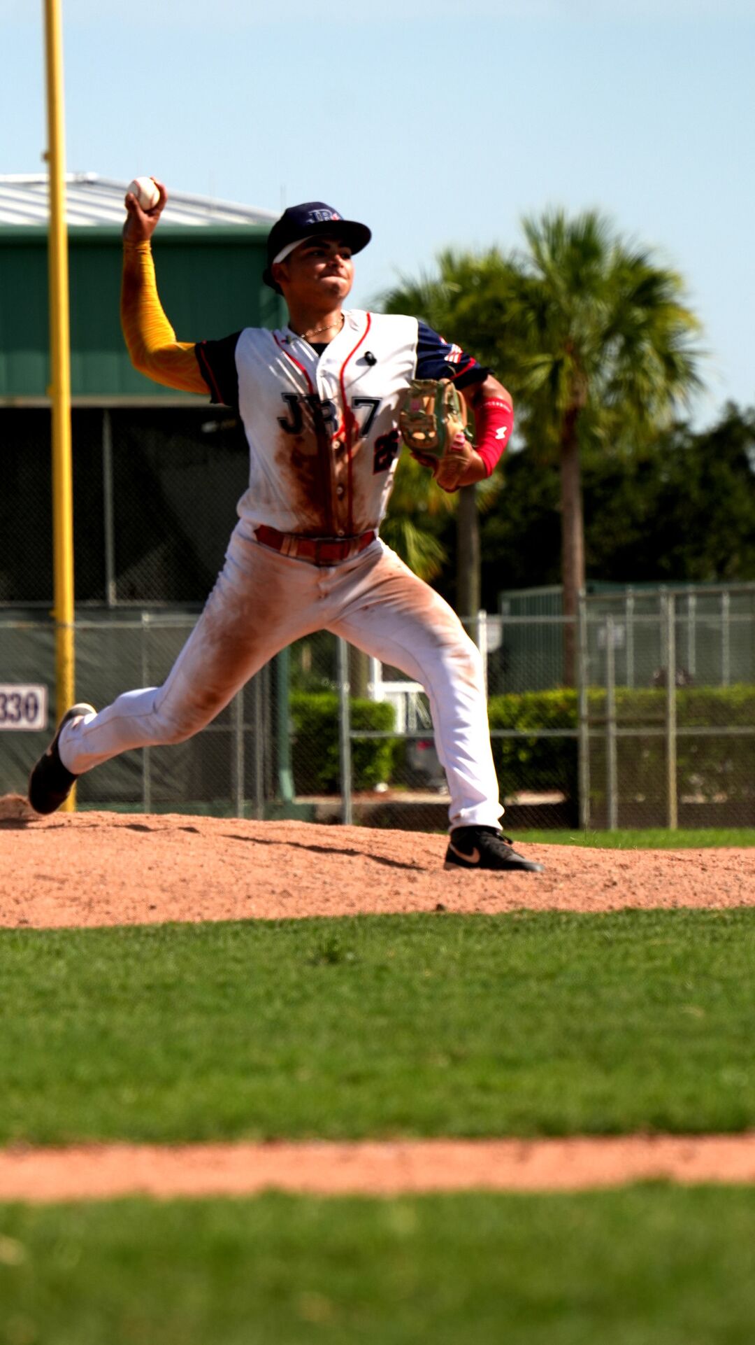 Pitcher at full extension on the mound