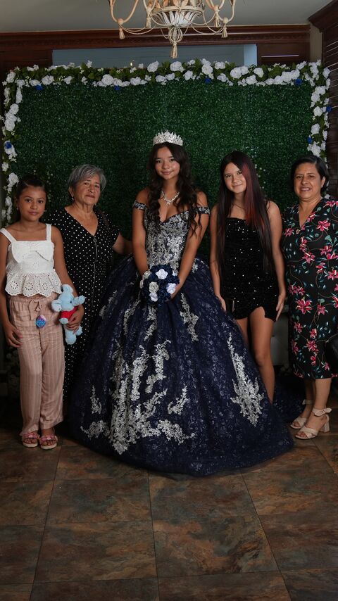 The quinceañera with a group of guests