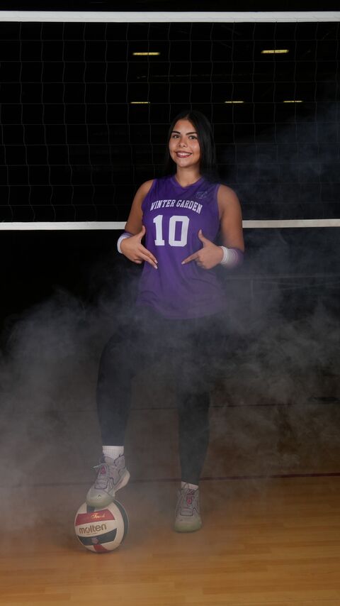 Player standing in the smoke with the ball at her feet